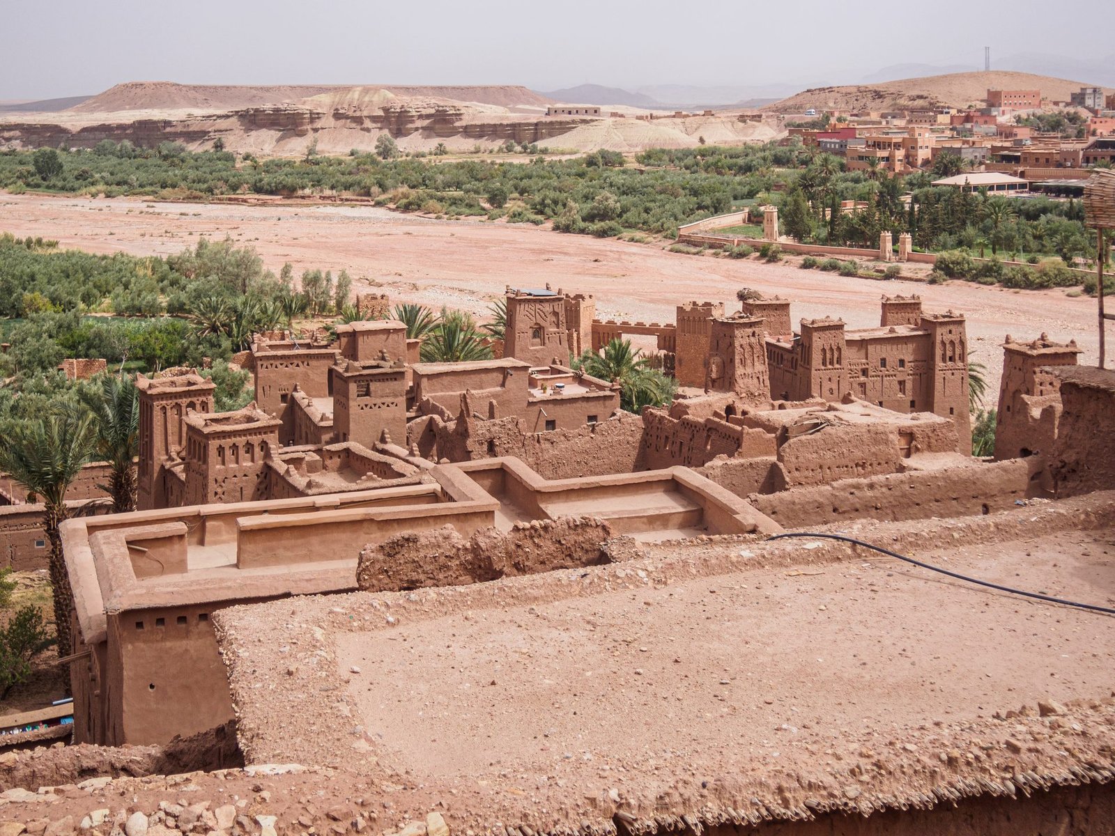Panoramic view of the Ait Benhaddou kasbah and palm grove