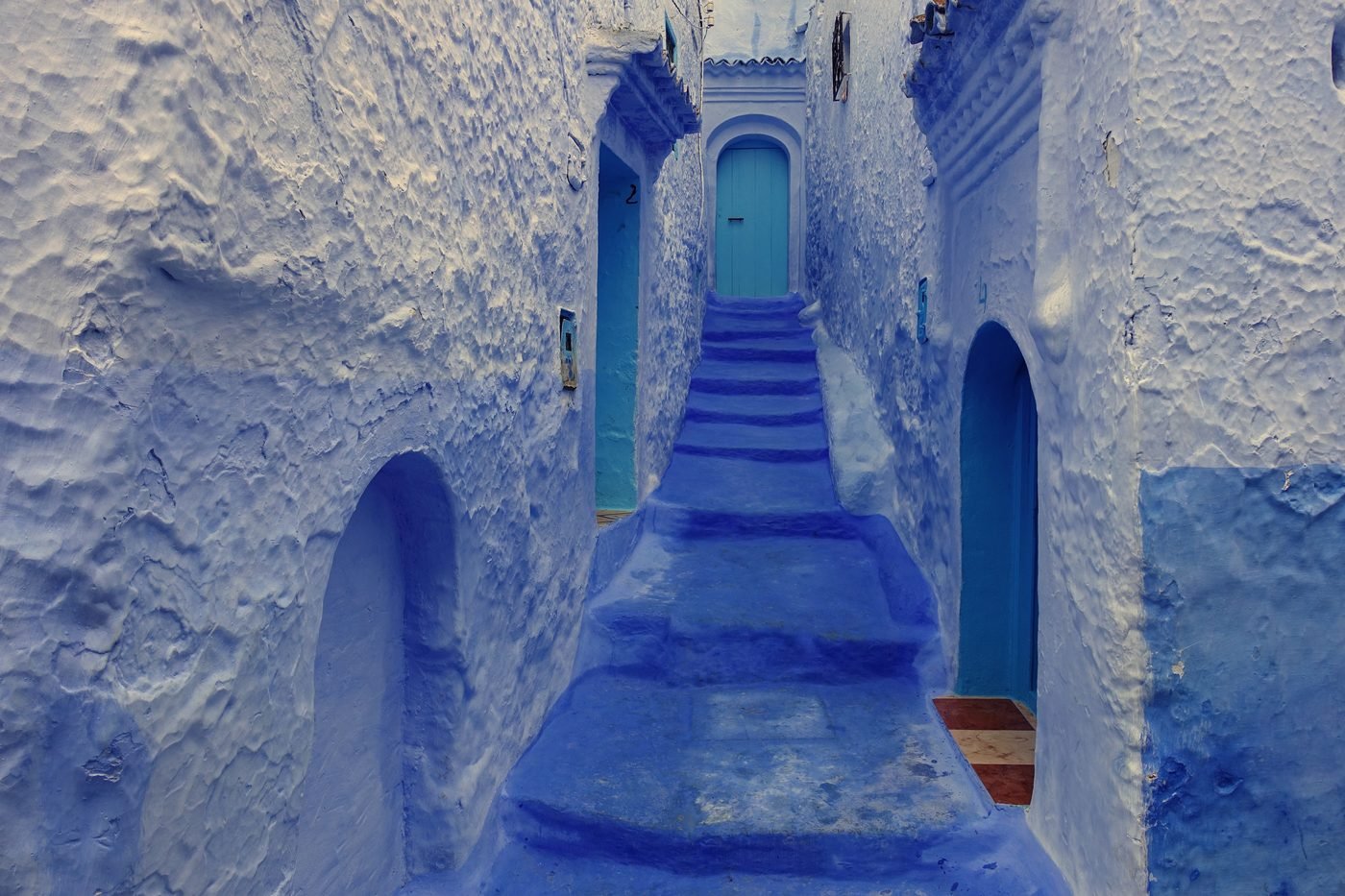 Blue-washed stepped alley in Chefchaouen's medina