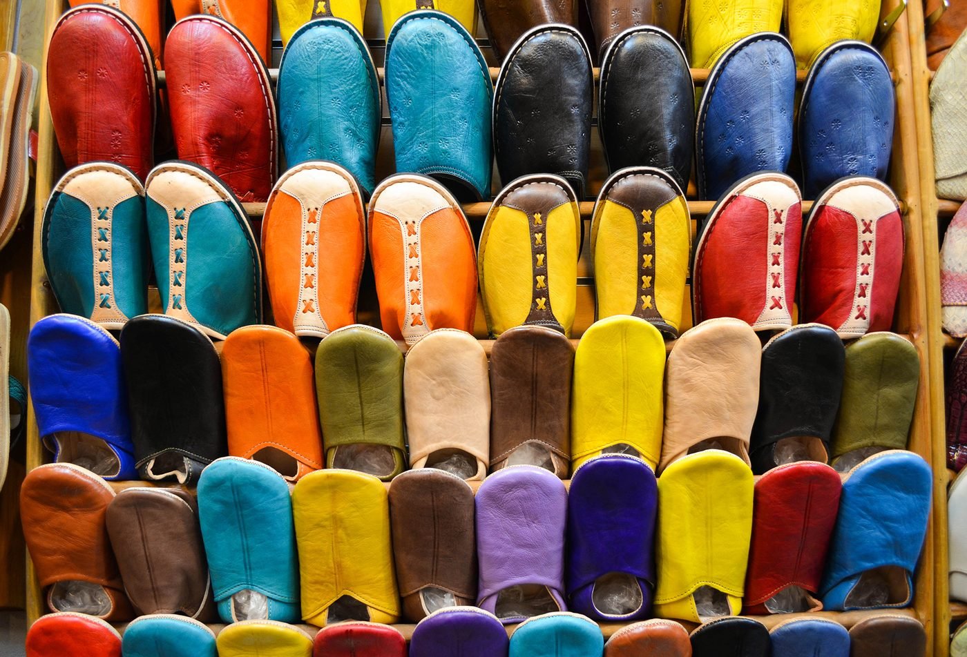 Colorful handmade babouche slippers in a Marrakech souk